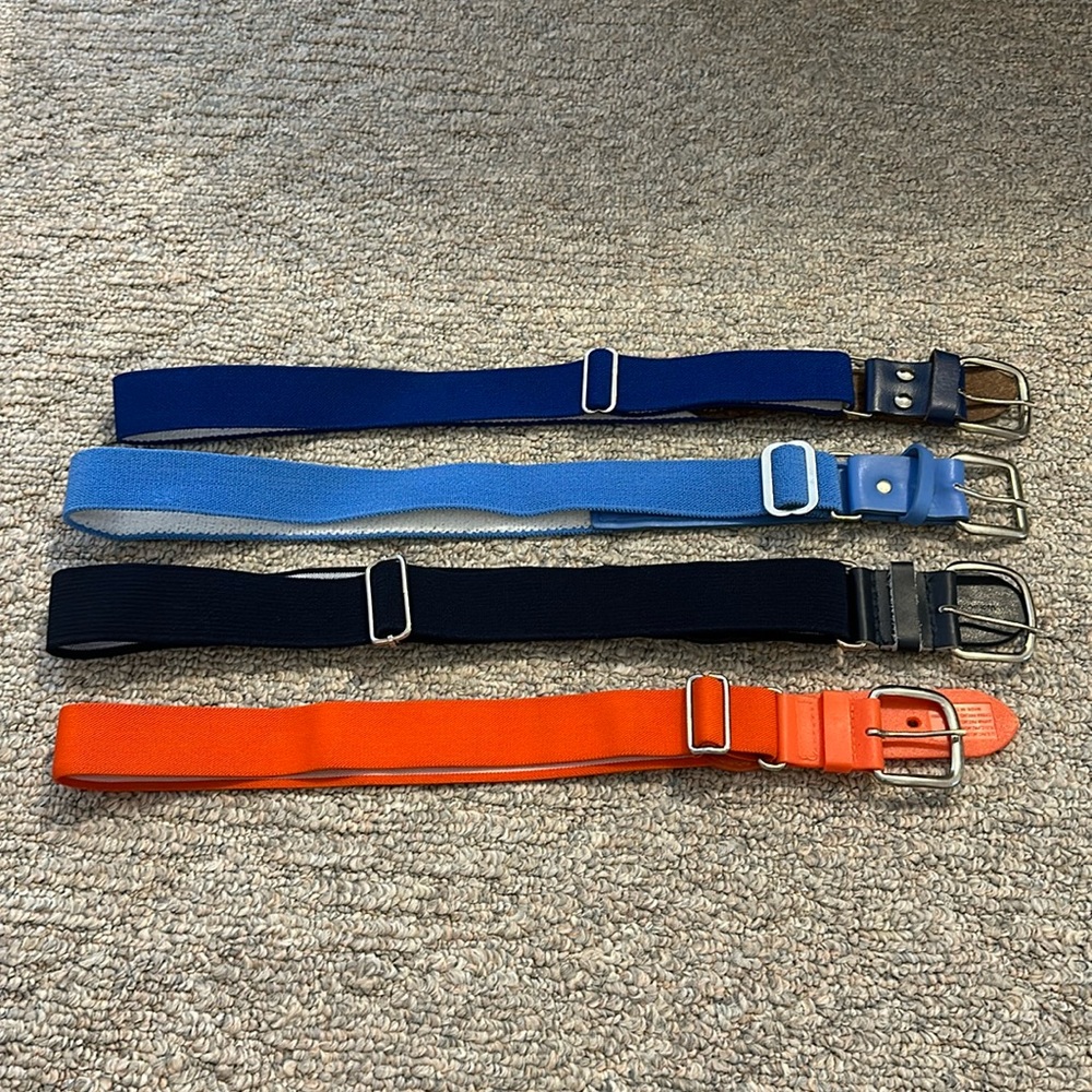4 one size softball belts. Great condition and adjustable.Can be sold separately